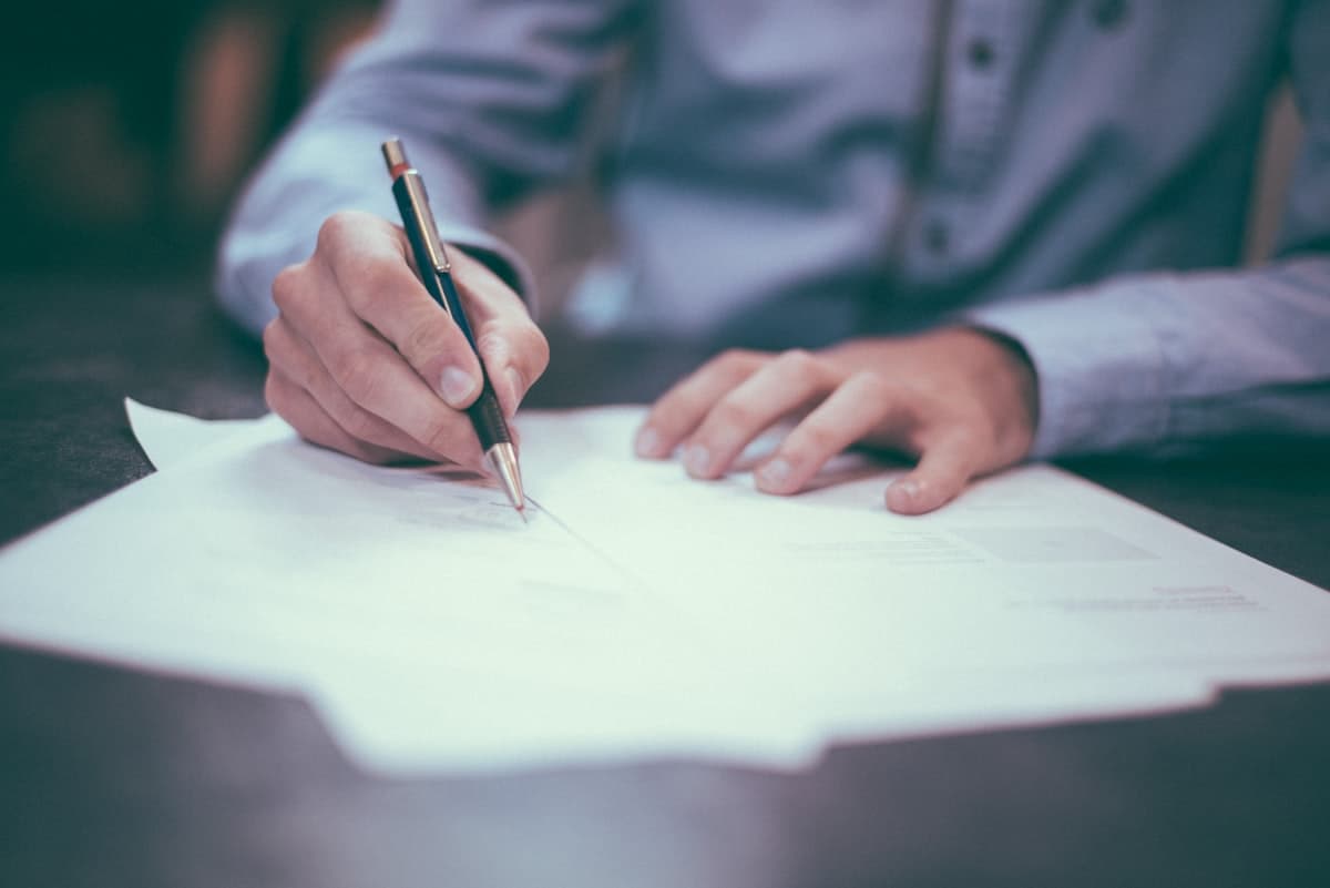 Professional reviewing documents at a desk